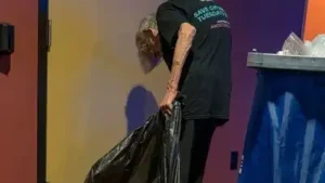 A 21-year-old Tennessee moviegoer noticed an 80-year-old AMC usher emptying trash after a screening