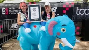 Two runners from Looe have set a world record after completing the London Marathon inside