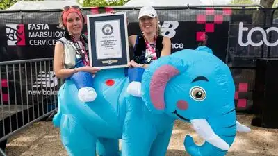 Two runners from Looe have set a world record after completing the London Marathon inside