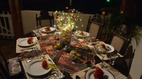 With a few pieces from your own cupboards, such as brass bowls, old sarees, flowers and diyas