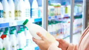 Milk arrives through the back of the store, moves into cold storage, and is stocked in coolers