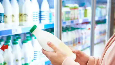 Milk arrives through the back of the store, moves into cold storage, and is stocked in coolers