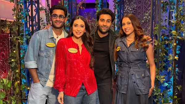 Karisma Kapoor makes a case for red satin shirts and baggy jeans, and we're taking notes