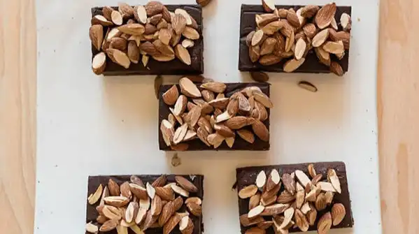 Almond fudge made with just almond butter and a natural sweetener comes together in about five