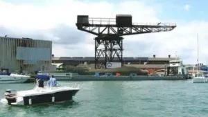A 150-foot crane overlooking England's Cowes waterfront faced the risk of collapse; after years