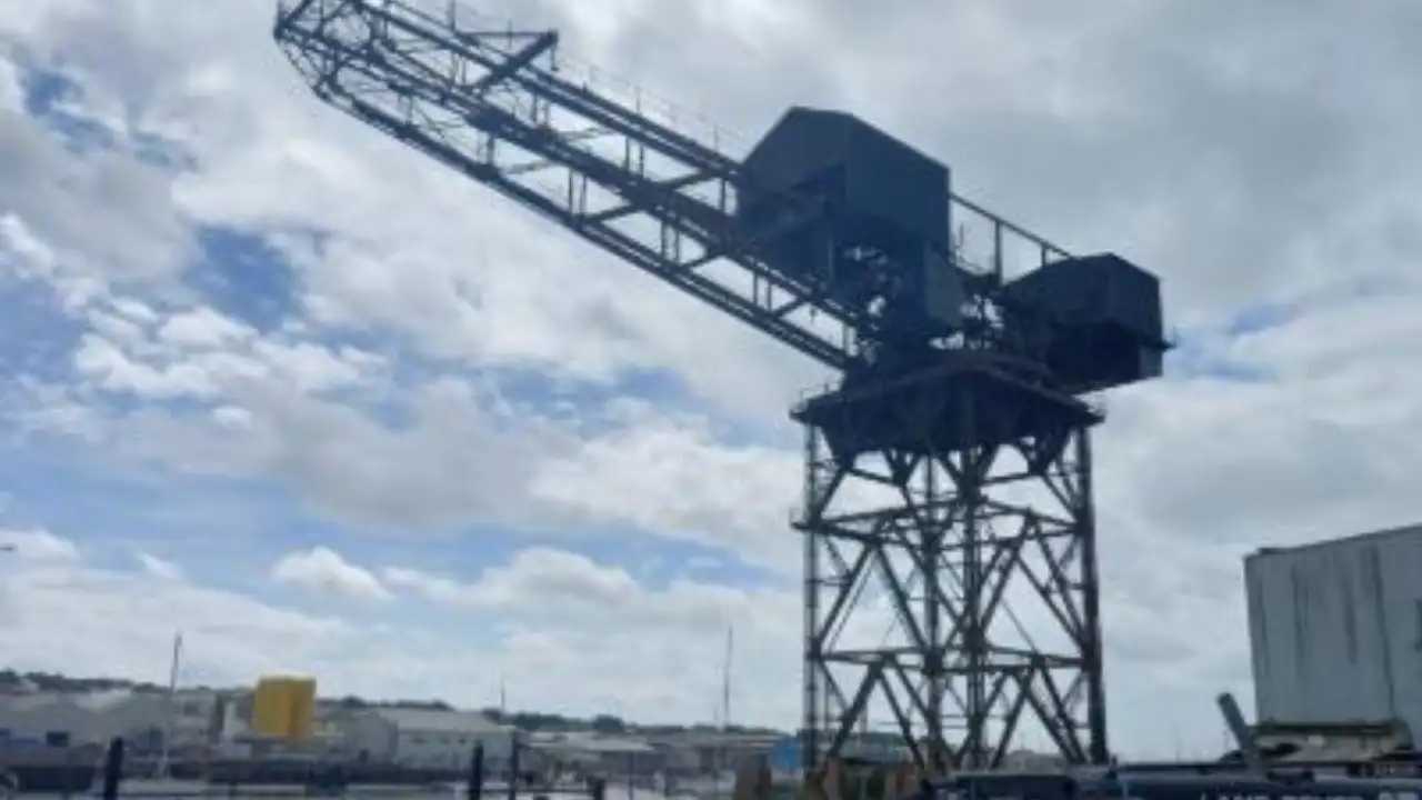 A 150-foot crane overlooking England's Cowes waterfront faced the risk of collapse; after years