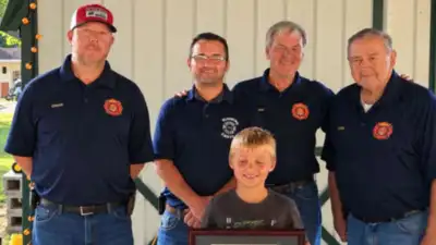 An 8-year-old Indiana boy spotted a smoking camper trailer and alerted people nearby before it