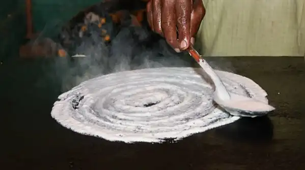 When the surface is too cool, the batter steams instead of crisping, and the dosa turns soft