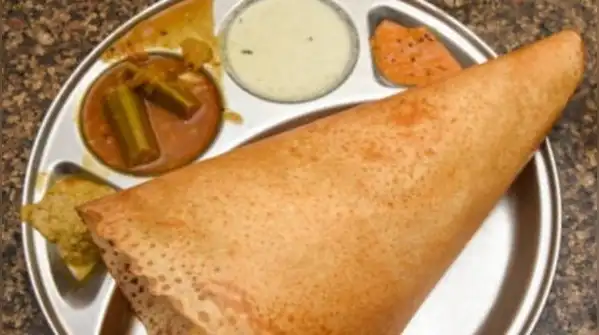 When the surface is too cool, the batter steams instead of crisping, and the dosa turns soft