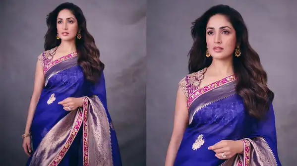 Yami went for a royal blue saree designed by Manish Malhotra for her first ensemble