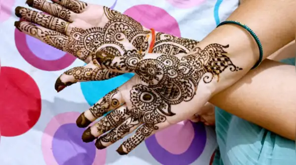 “Create a graceful Navratri mehendi design for both hands featuring detailed lotus flowers