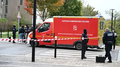 (AP Photo/Emma Da Silva) Police stand near a park after a shooting in Trappes, outside Paris