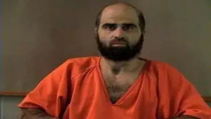 Handout photo of Nidal Hasan, charged with killing 13 people and wounding 31 in a November 2009