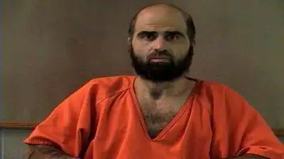 Handout photo of Nidal Hasan, charged with killing 13 people and wounding 31 in a November 2009