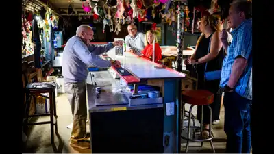 A 103-year-old World War II veteran has been tending the same basement bar in Maryland since 1963