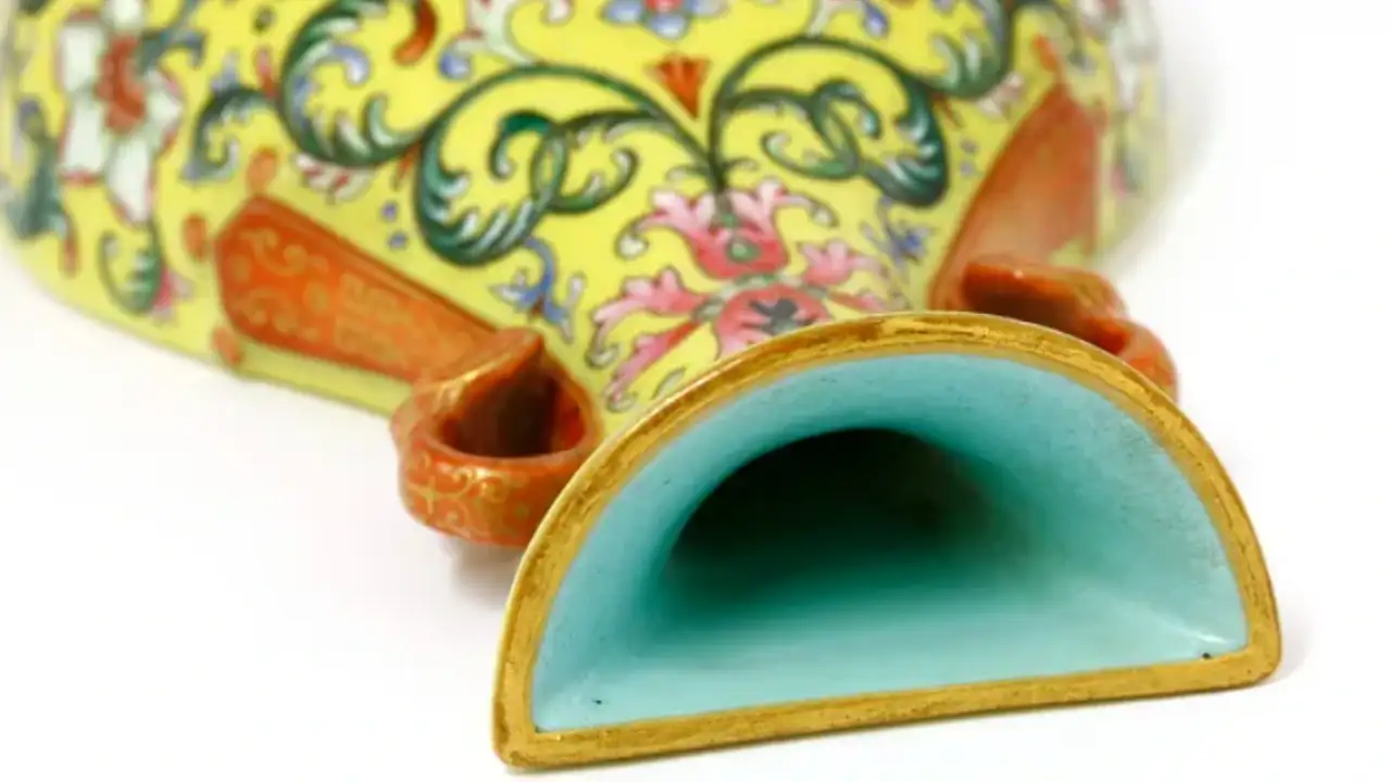 A UK shopper paid just £1 for a small yellow vase at a Hertfordshire charity shop; after eBay