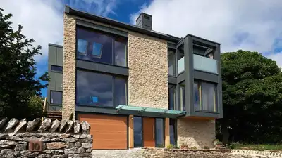 A Yorkshire couple built a four-bedroom home using straw bales and lime plaster; completed in 2018