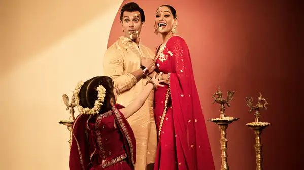 Adopting the most classic festive colours of red and gold, she enhanced her Durga Puja
