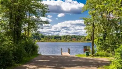 A Michigan family owned a one-third-acre lakefront cottage before Prairie View Park was built; more