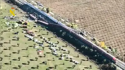 Drone view shows tilted carriages, twisted rail body at site — Spain train accident