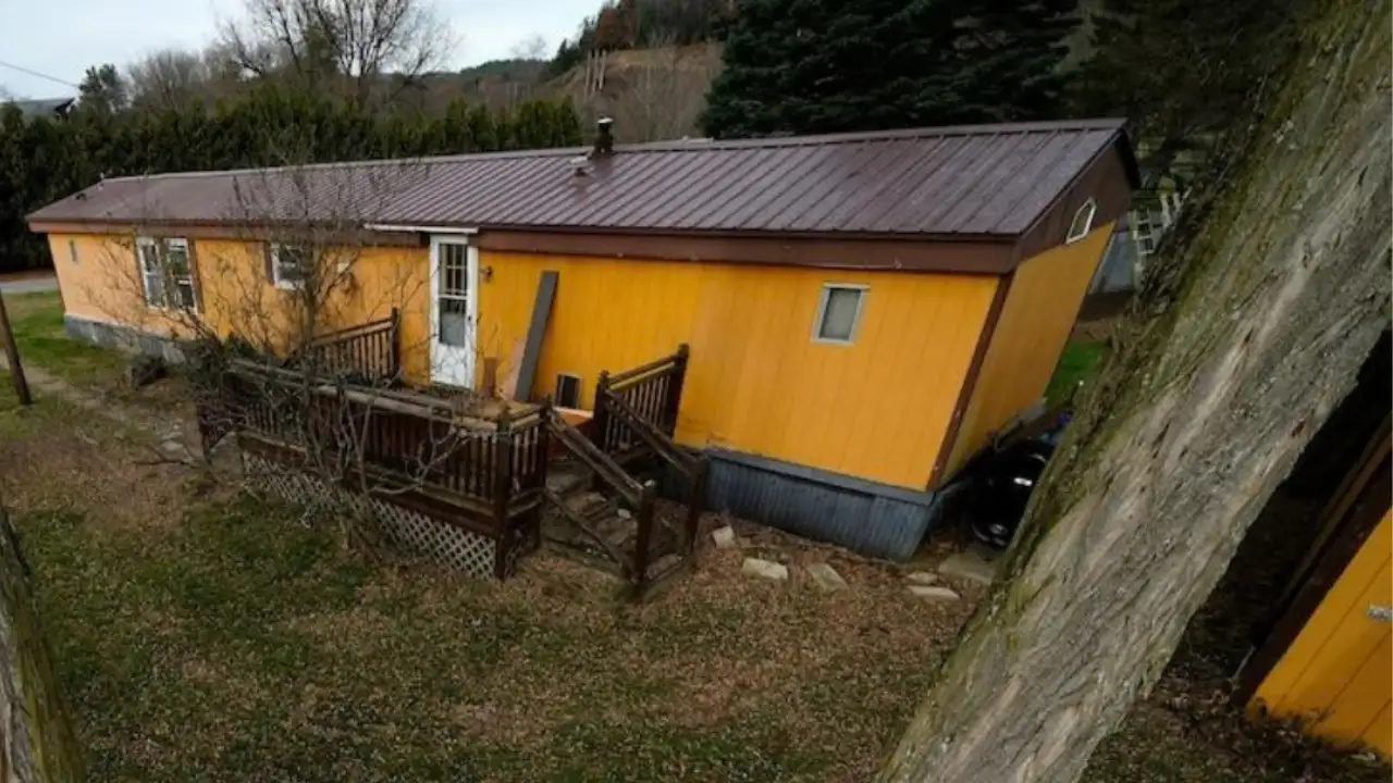 A New Hampshire groundskeeper lived in an empty trailer and mowed lawns; after his death, town