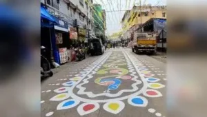 Alpana, a traditional Bengali folk art, painted on the street leading to the entrance